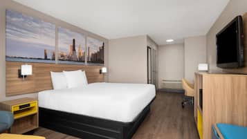 Room, 1 King Bed, Non Smoking (Exterior Building) | Desk, laptop workspace, iron/ironing board, bed sheets