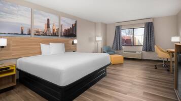 Deluxe Room, 1 King Bed, Non Smoking | Desk, laptop workspace, iron/ironing board, bed sheets