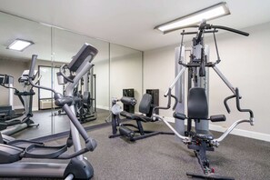 Work out in style with our fully equipped gym featuring treadmills, a stationary bike, and a weight machine.