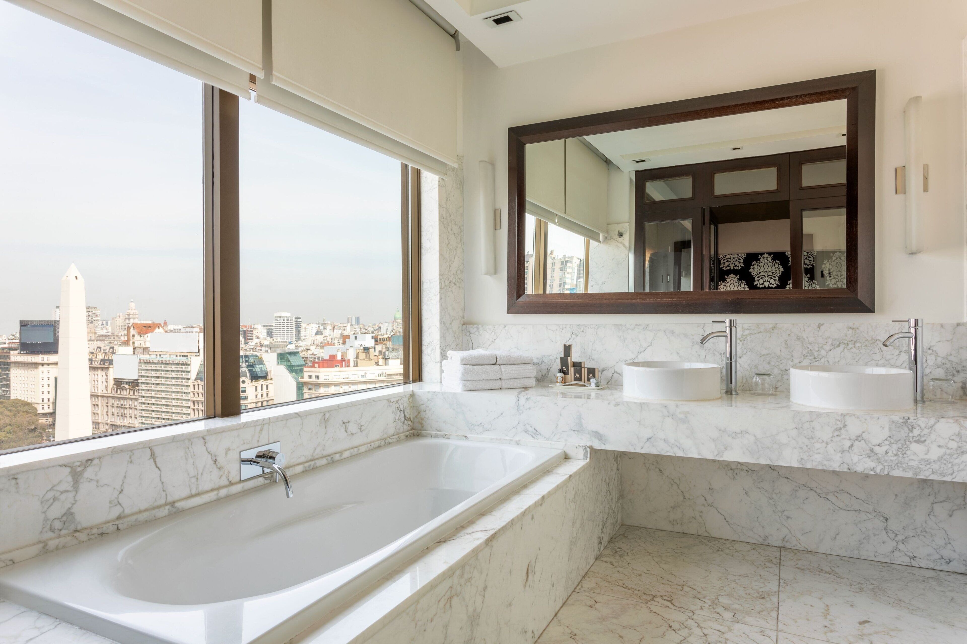 deluxe suite, 1 king bed | bathroom | combined shower/bathtub, deep-soaking bathtub, free toiletries