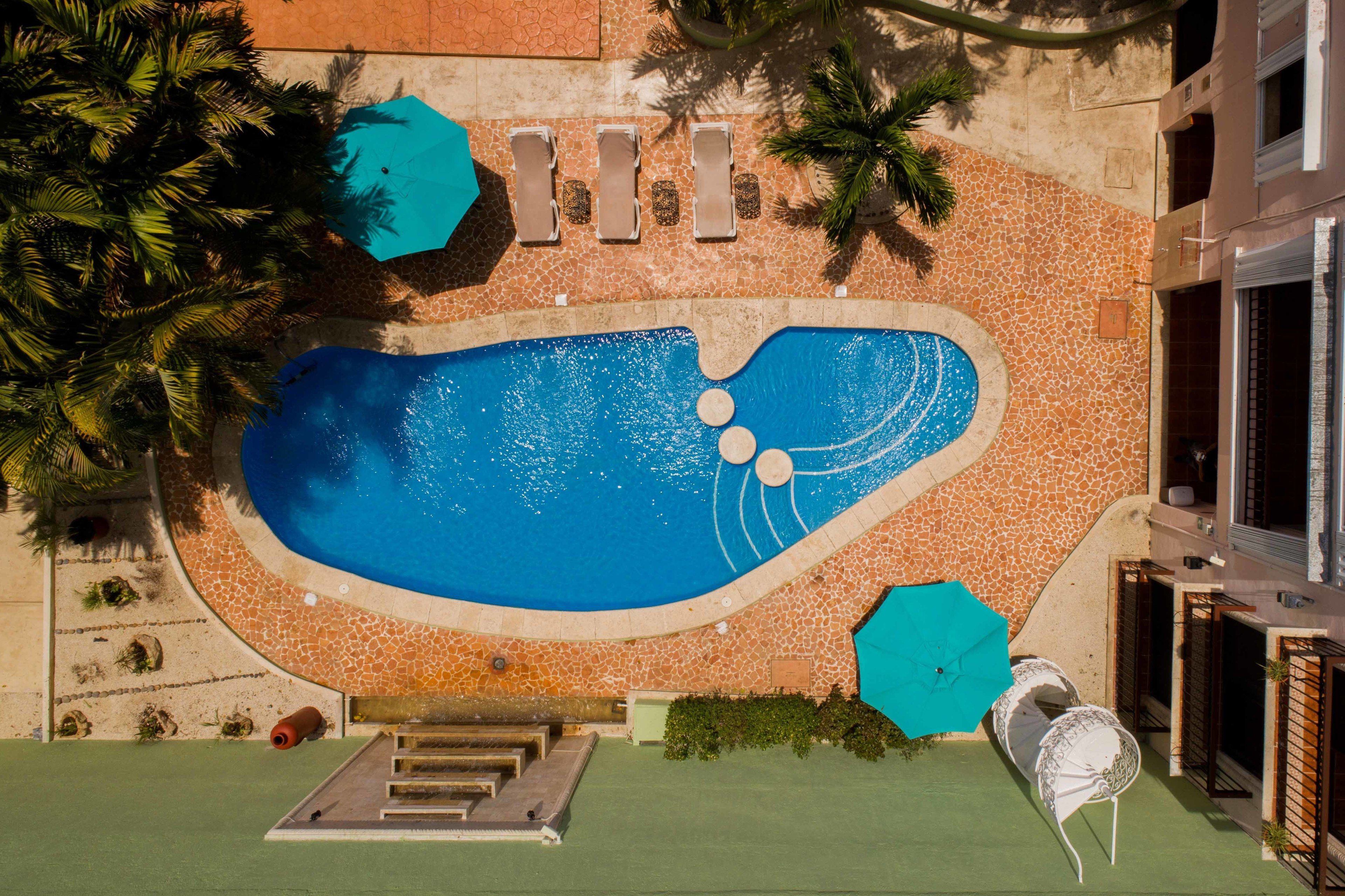 outdoor pool, open 9:00 am to 9:00 pm, pool umbrellas, pool loungers