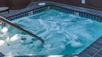 Relax in a soothing hot tub with a metal ladder for easy access.