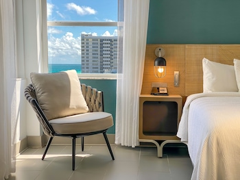 Premium bedding, pillowtop beds, in-room safe, laptop workspace at Marseilles Beachfront Hotel