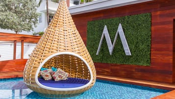 Outdoor pool, open 8 AM to 8 PM, pool cabanas (surcharge)