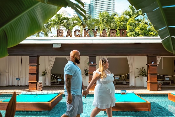 Outdoor pool, open 8 AM to 8 PM, cabanas (surcharge), pool umbrellas