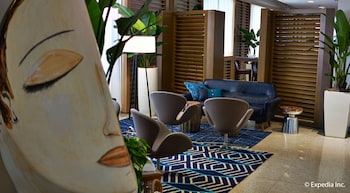 Sitting area in hotel lobby at Marseilles Beachfront Hotel