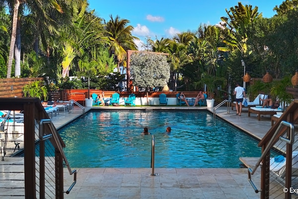 Outdoor pool, open 8 AM to 8 PM, cabanas (surcharge), pool umbrellas