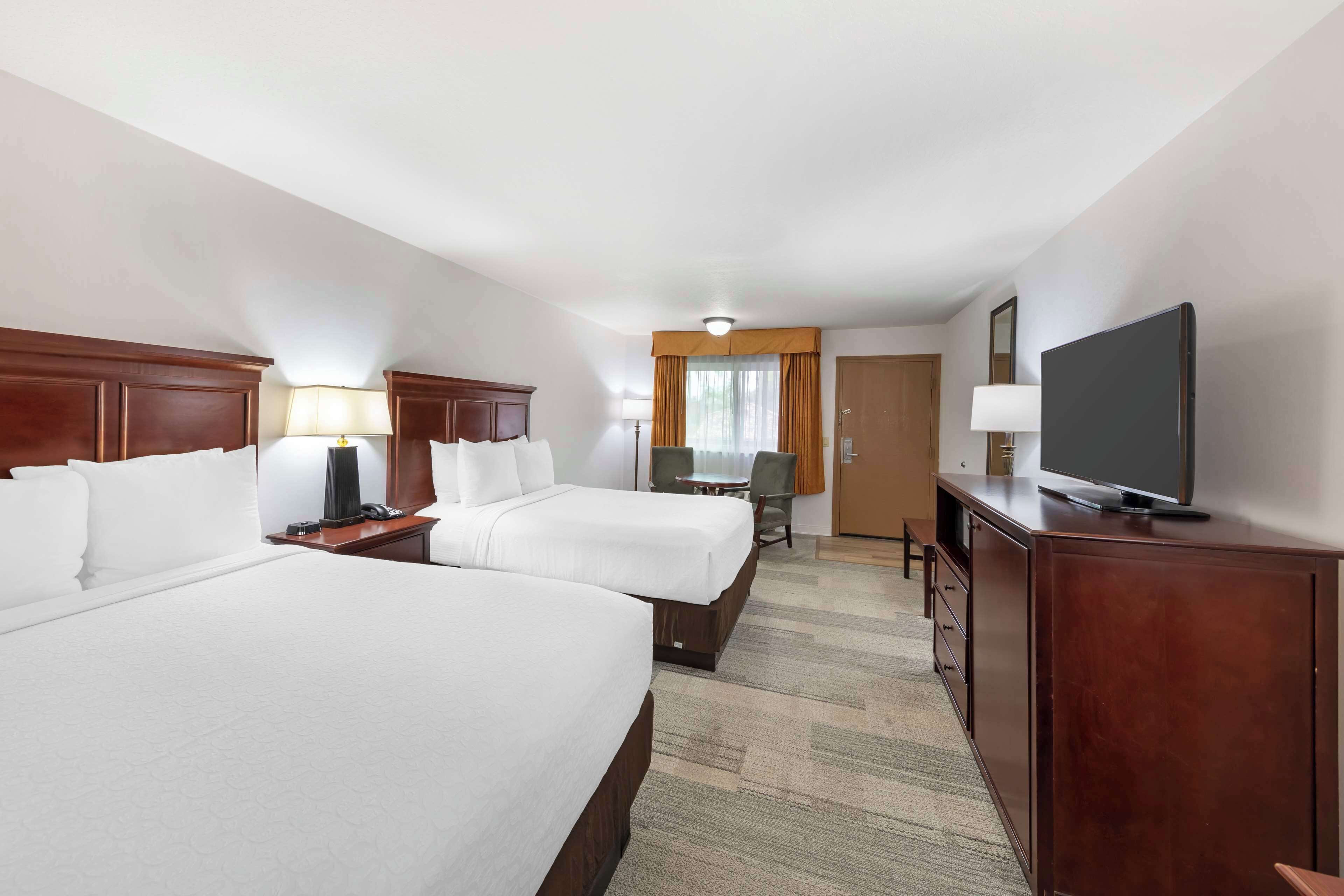 pillow-top beds, desk, laptop workspace, blackout curtains