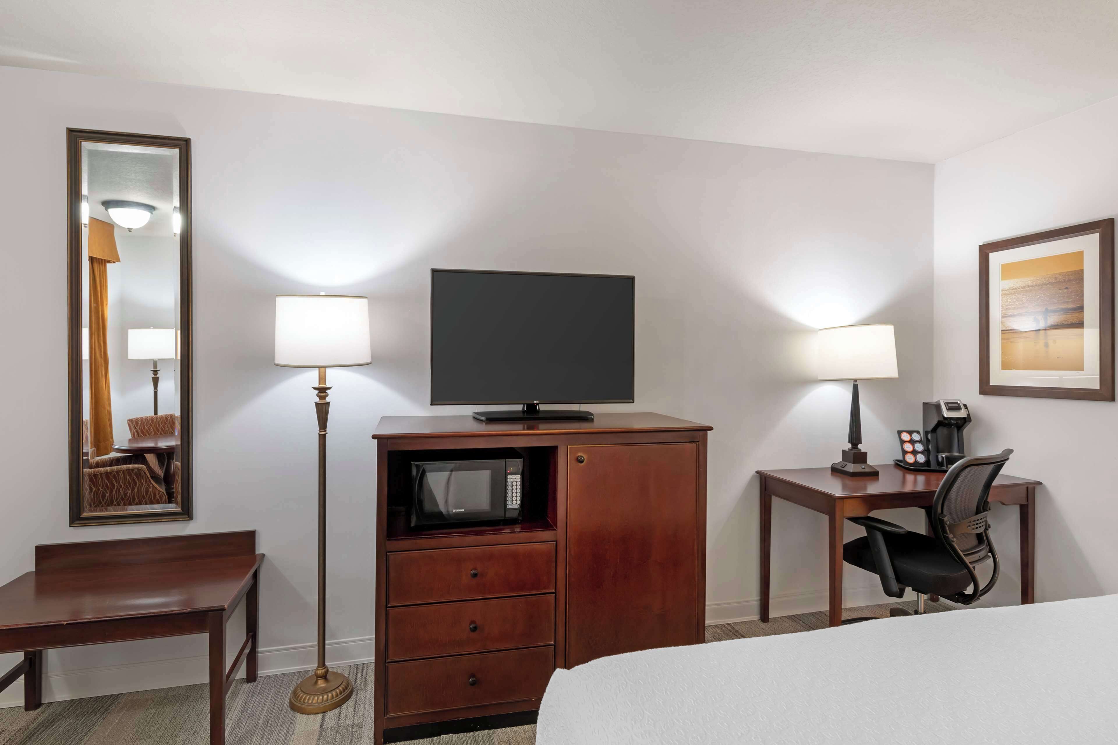 pillow-top beds, desk, laptop workspace, blackout curtains