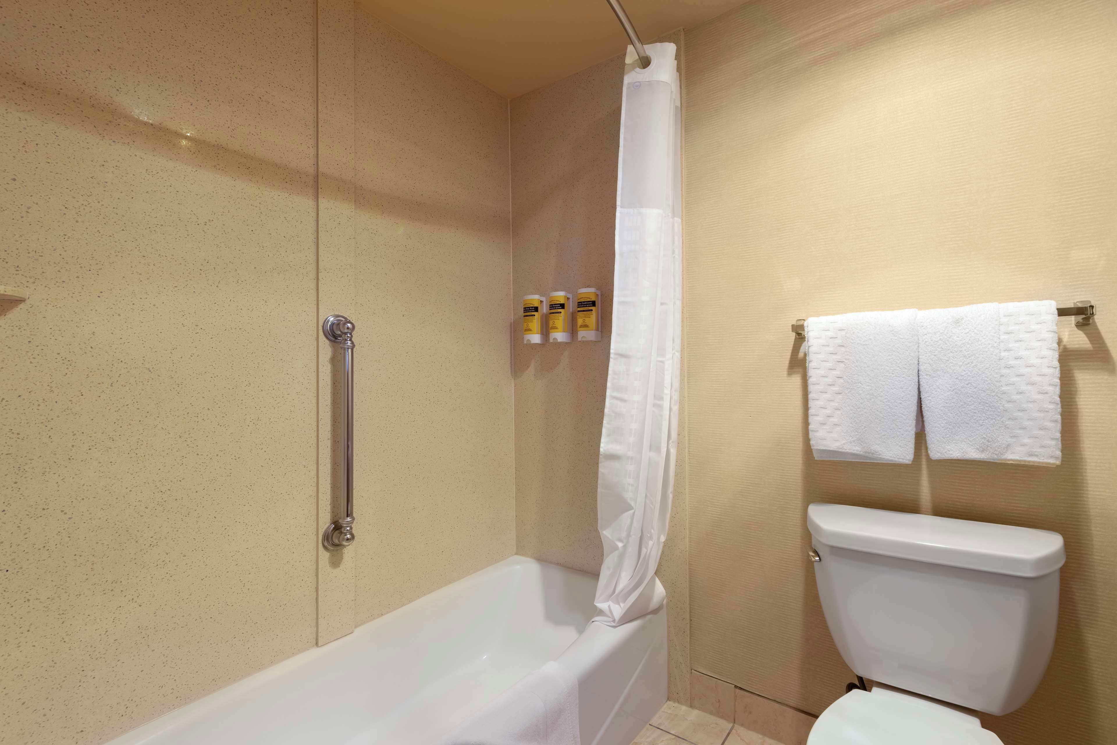 deep-soaking bathtub, free toiletries, hair dryer, towels