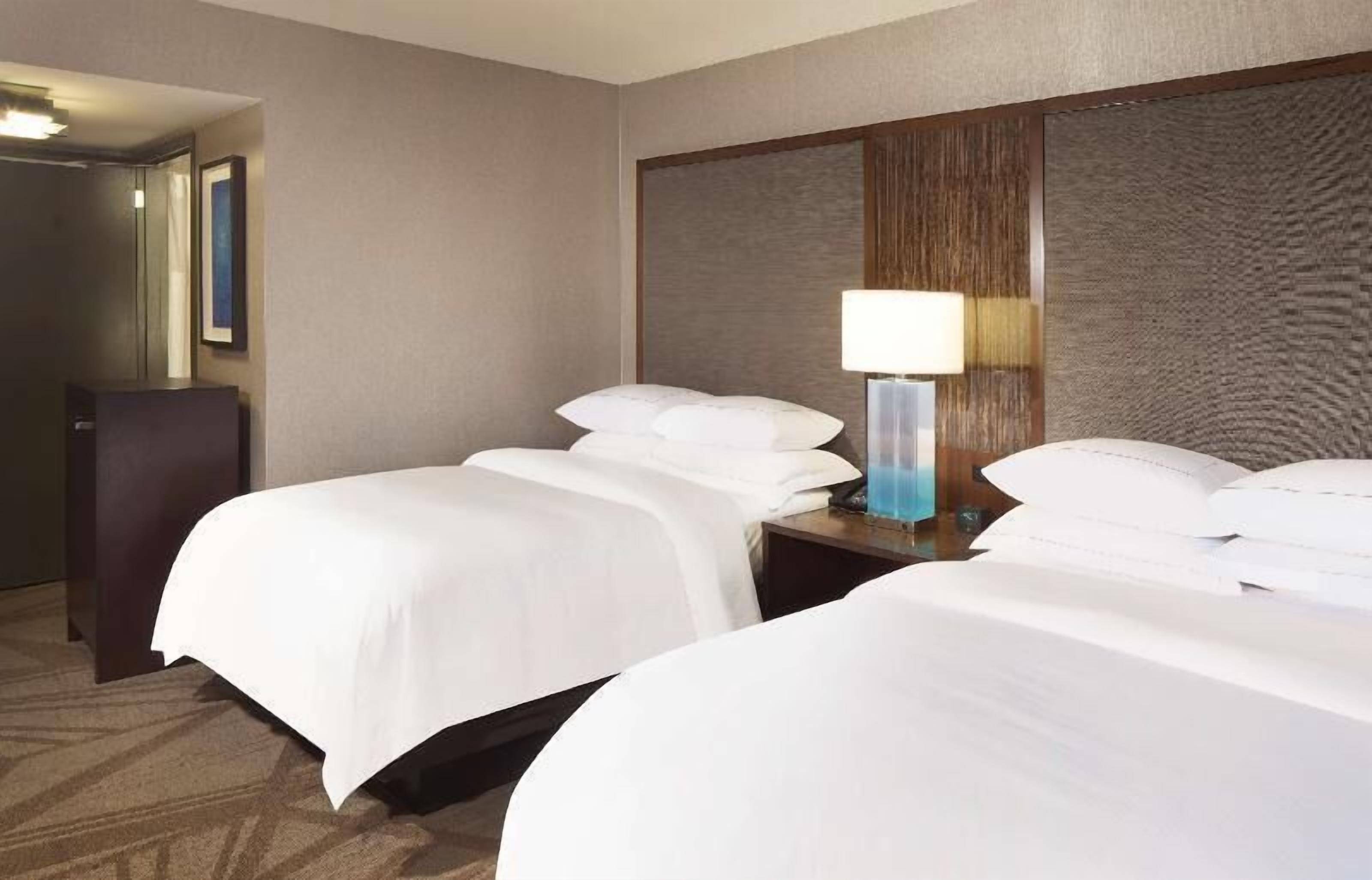 Premium bedding, down comforters, pillowtop beds, in-room safe
