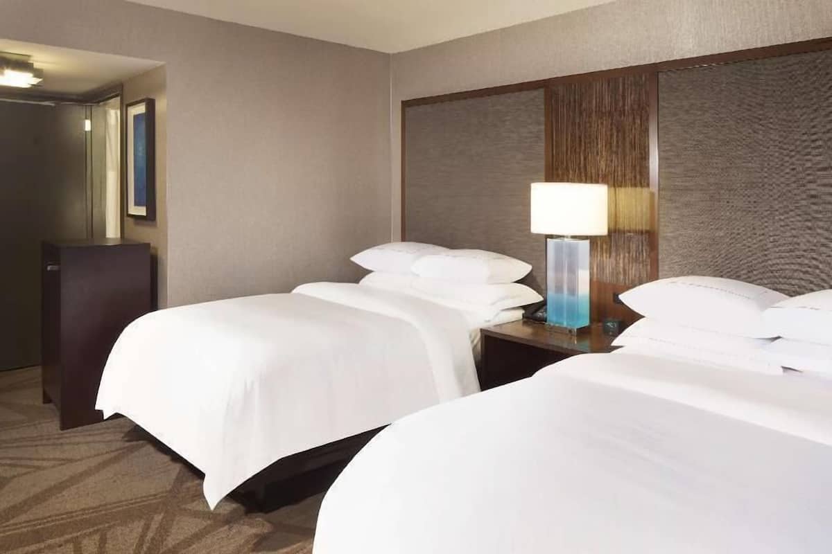 Premium bedding, down comforters, pillowtop beds, in-room safe