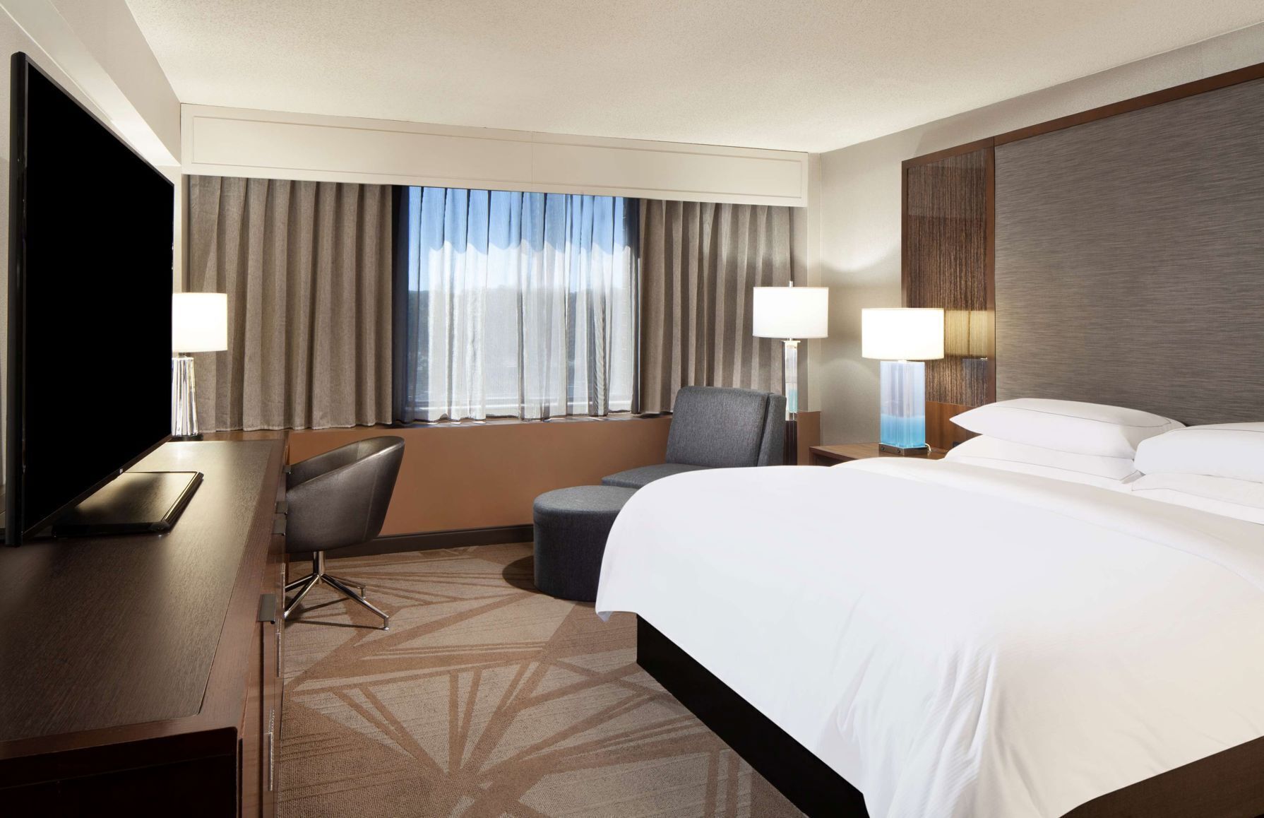 Premium bedding, down comforters, pillowtop beds, in-room safe