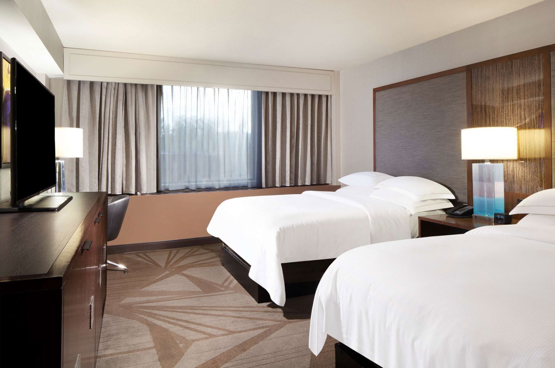 Premium bedding, down comforters, pillowtop beds, in-room safe