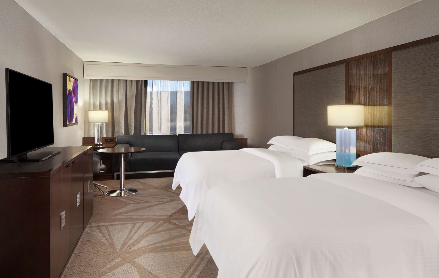 Premium bedding, down comforters, pillowtop beds, in-room safe