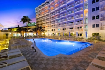 2 outdoor pools, open 8:00 AM to 5:00 PM, pool umbrellas, sun loungers at Beachcomber Resort & Club