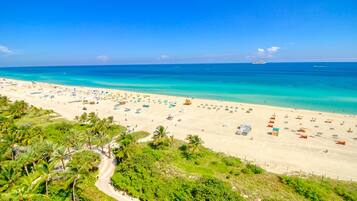 On the beach, white sand, beach towels