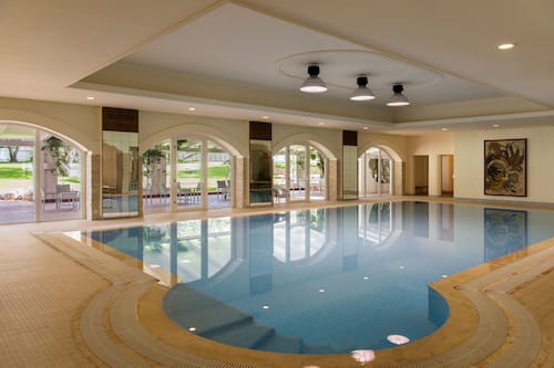 Indoor pool, seasonal outdoor pool, open 10:00 AM to 6 PM, pool loungers