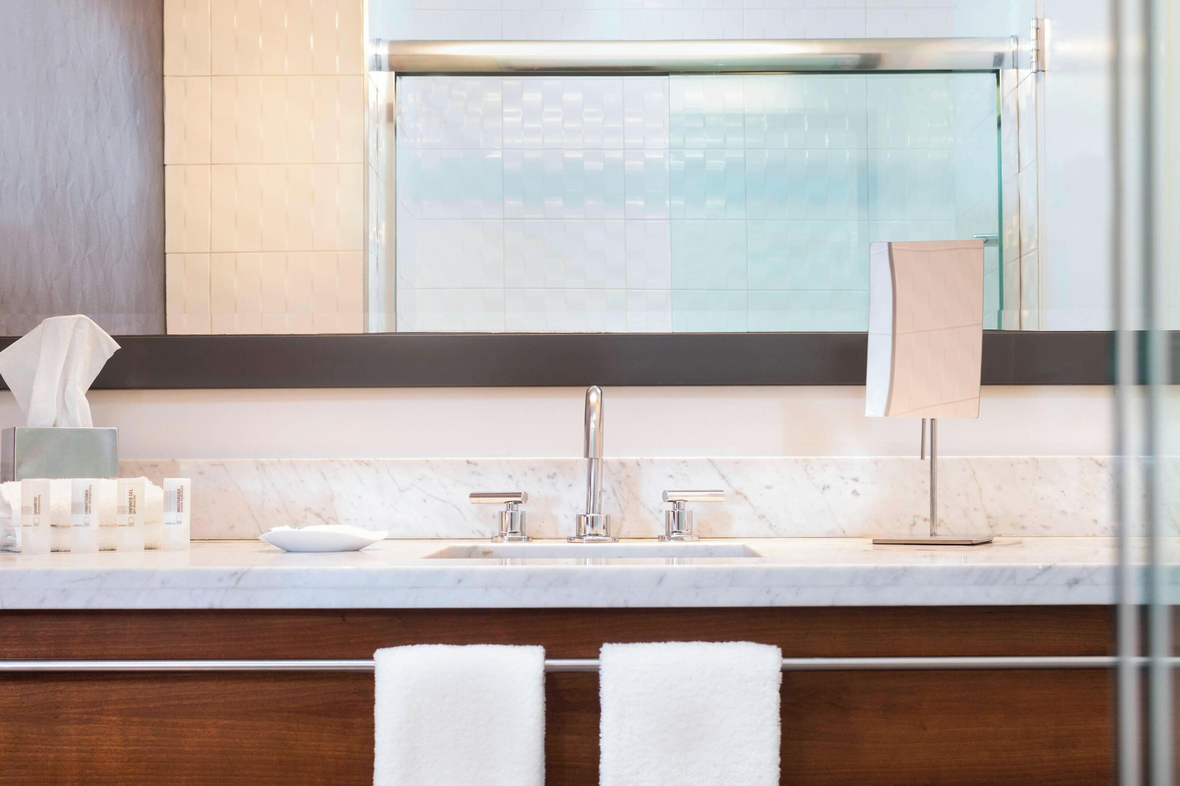 designer toiletries, hair dryer, bathrobes, towels