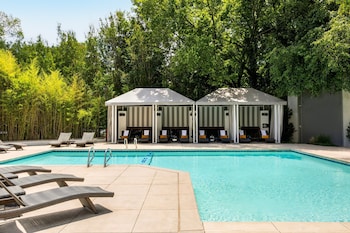 Seasonal outdoor pool, cabanas (surcharge), pool umbrellas at Le Meridien Atlanta Perimeter by Marriott
