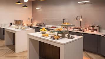 A modern breakfast buffet with various food items and a clean, contemporary design.