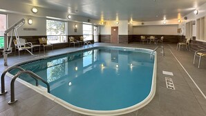 An indoor swimming pool with clear water, surrounded by lounge chairs and a no diving sign. - Country Inn & Suites by Radisson, Bismarck-Mandan (Bismarck)