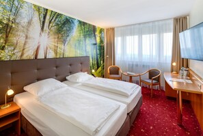 Caja fuerte, cortinas opacas, wifi gratis y ropa de cama