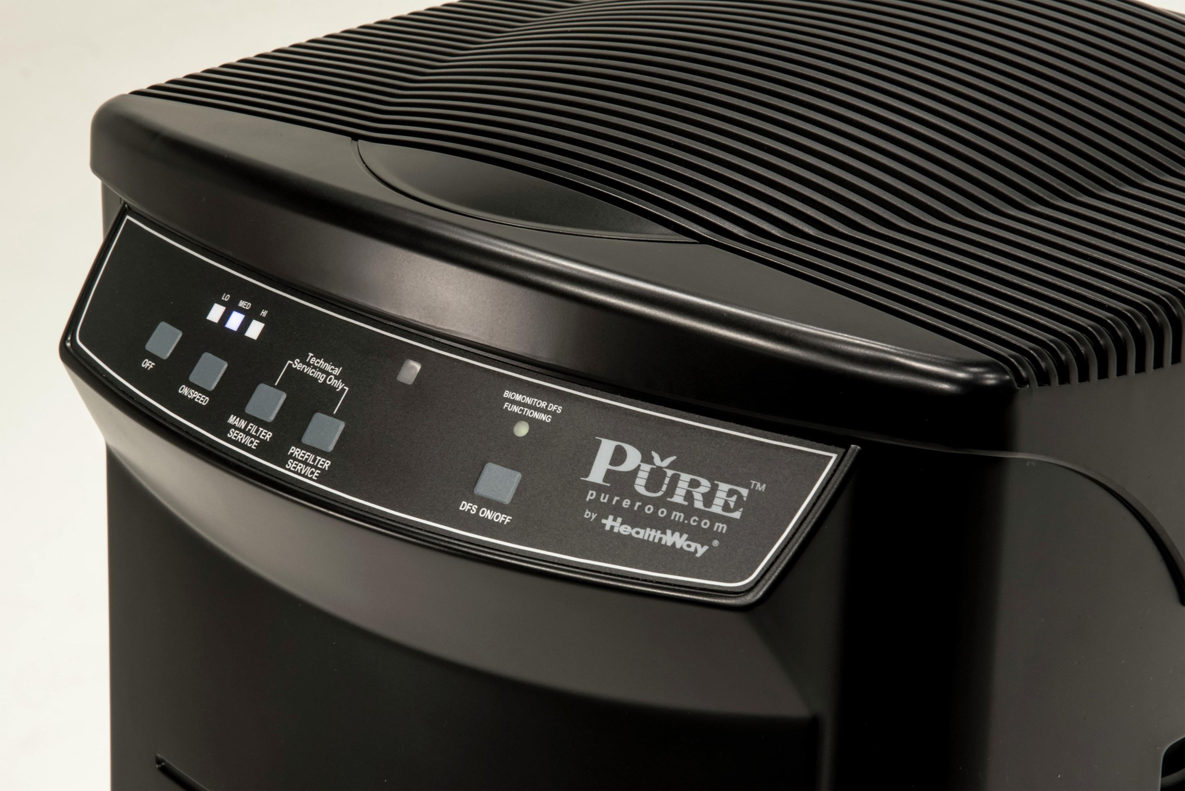 A black air purifier with a control panel displaying various service options.