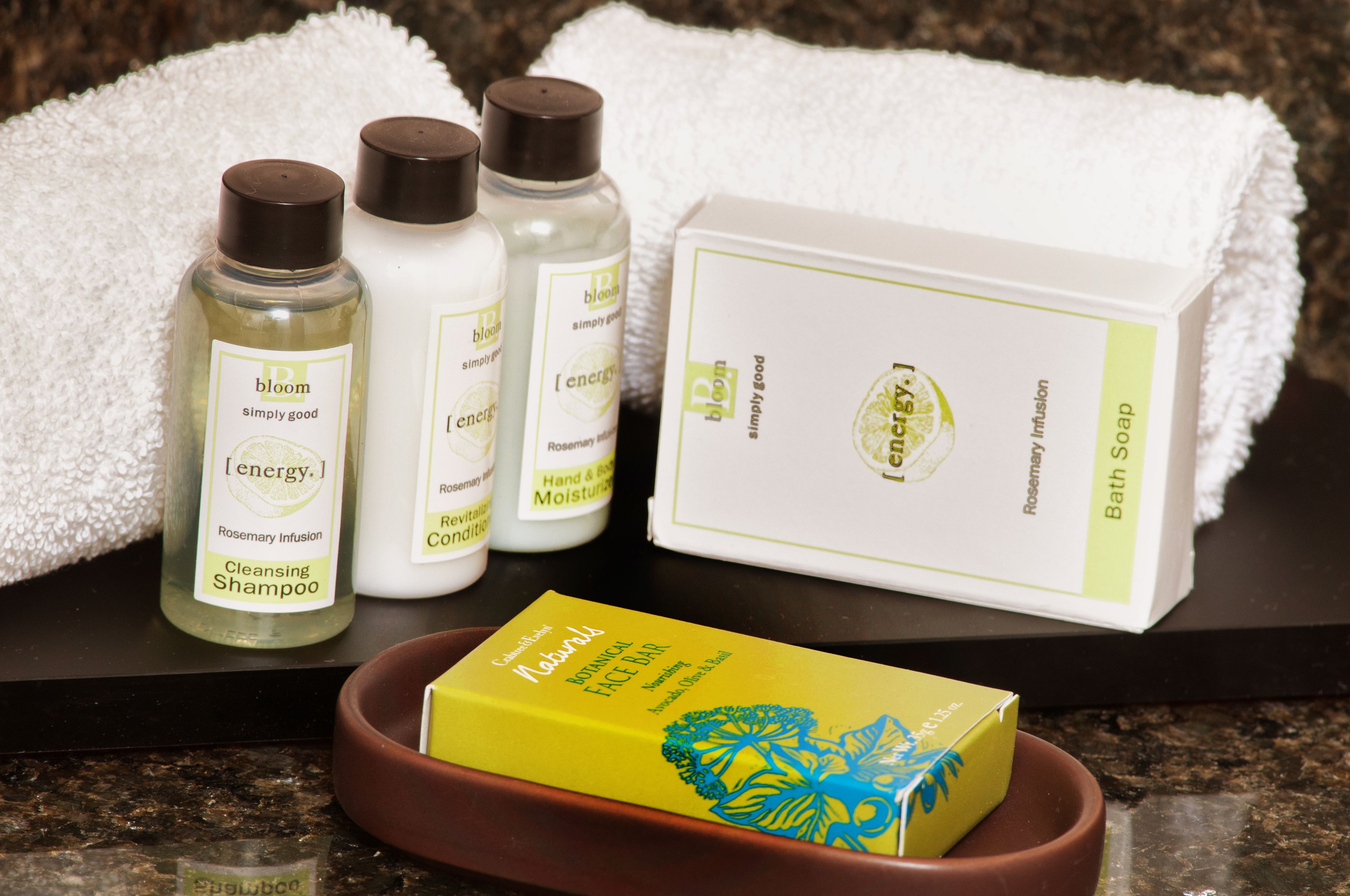 designer toiletries, hair dryer, towels