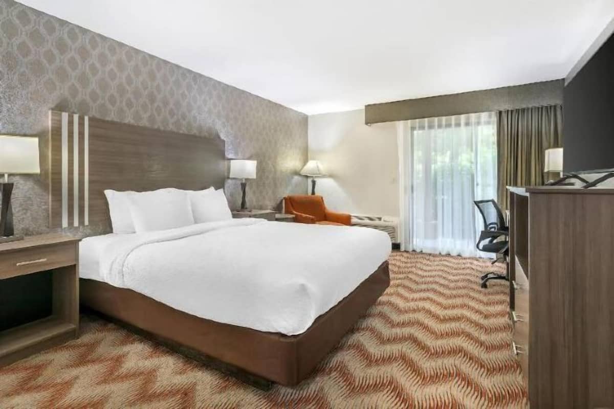 Desk, laptop workspace, blackout curtains, iron/ironing board