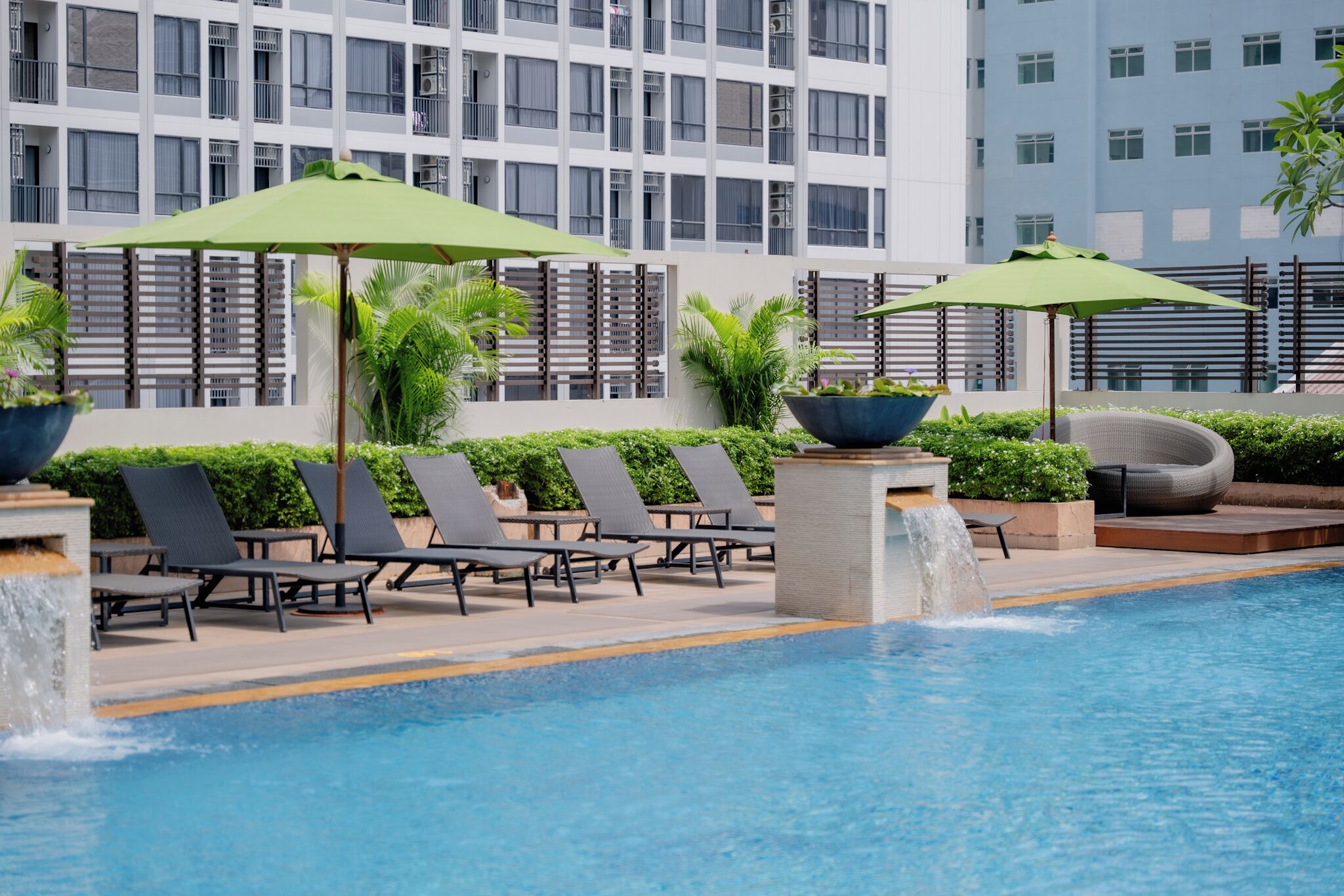 outdoor pool, pool umbrellas, pool loungers