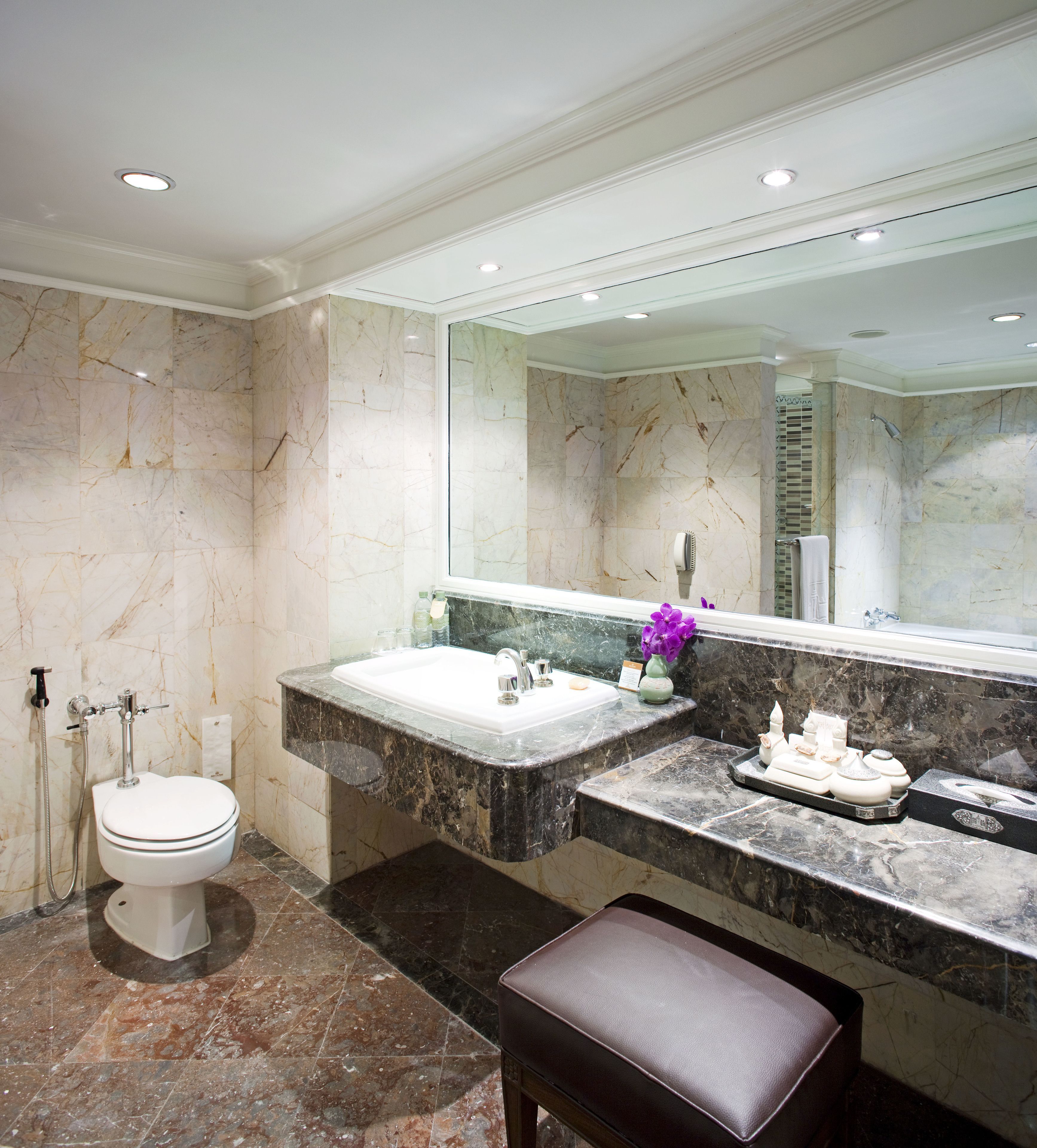 designer toiletries, hair dryer, bathrobes, slippers