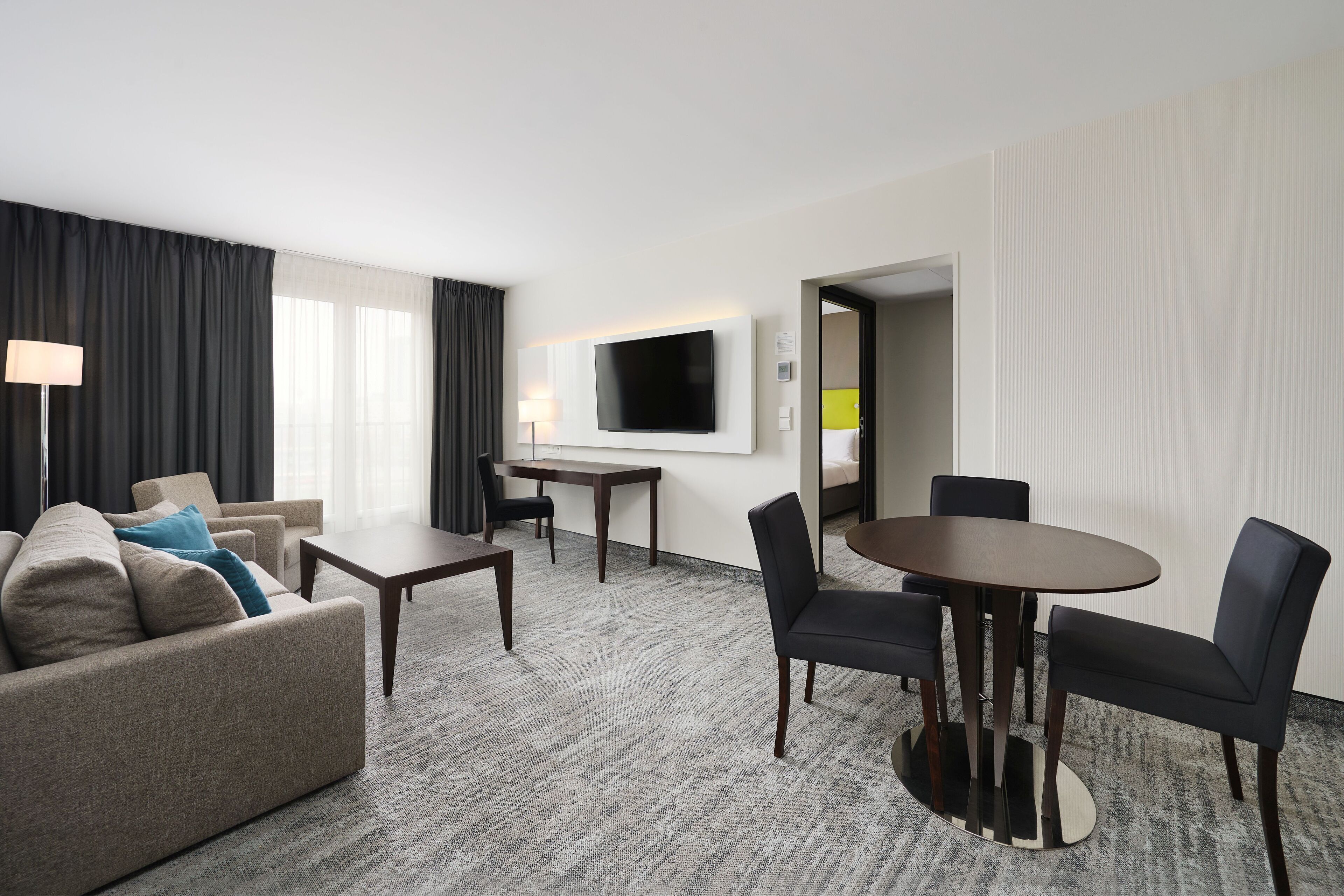 Family Suite | Minibar, in-room safe, desk, blackout drapes