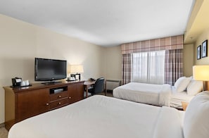 Premium bedding, pillow-top beds, desk, laptop workspace