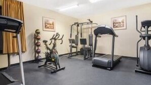 A gym with cardio equipment, weight machines, and a treadmill. - Days Inn by Wyndham Indianapolis/Castleton (Indianapolis)