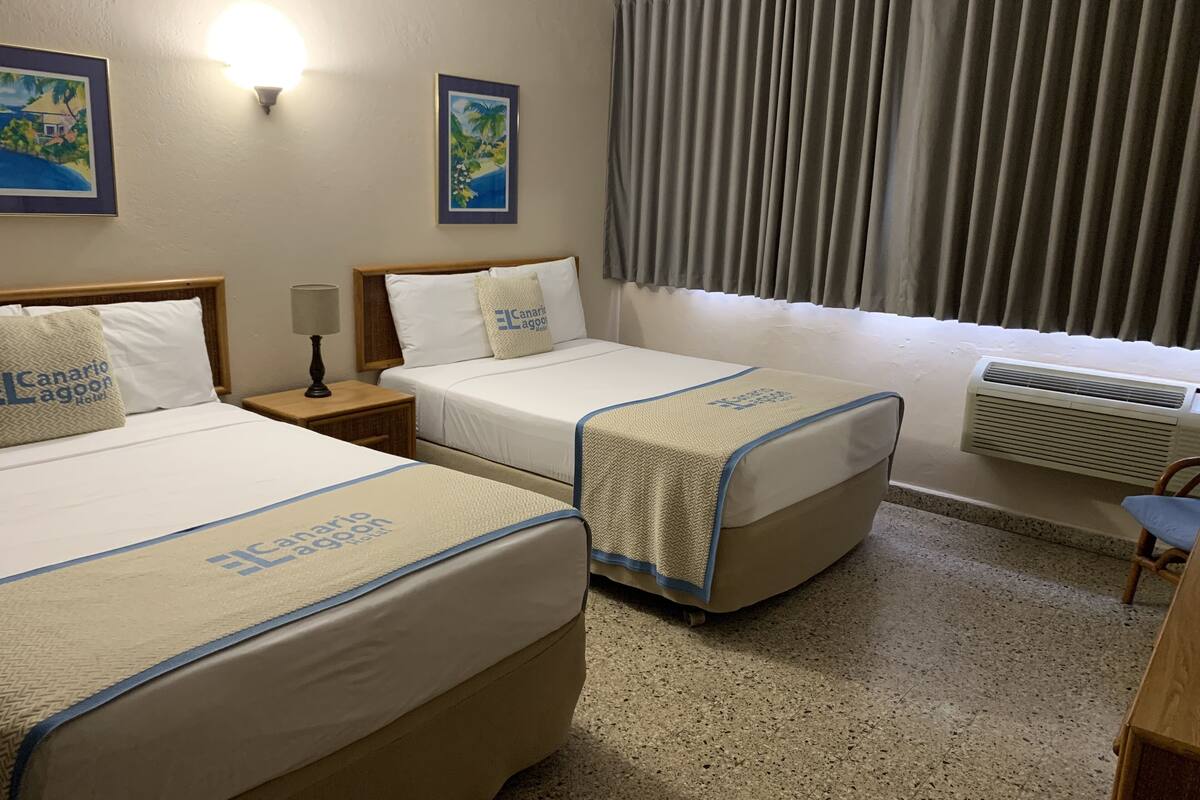 Penthouse, 2 Queen Beds, Kitchenette | Pillowtop beds, blackout drapes, free WiFi, bed sheets