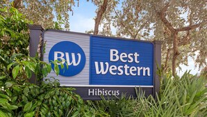 A sign for Best Western hotel with the logo 'BW' and the name 'Hibiscus'. - Best Western Hibiscus Motel (Key West)