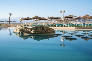 Indoor pool, outdoor pool, open 8 AM to 6:30 PM, pool umbrellas