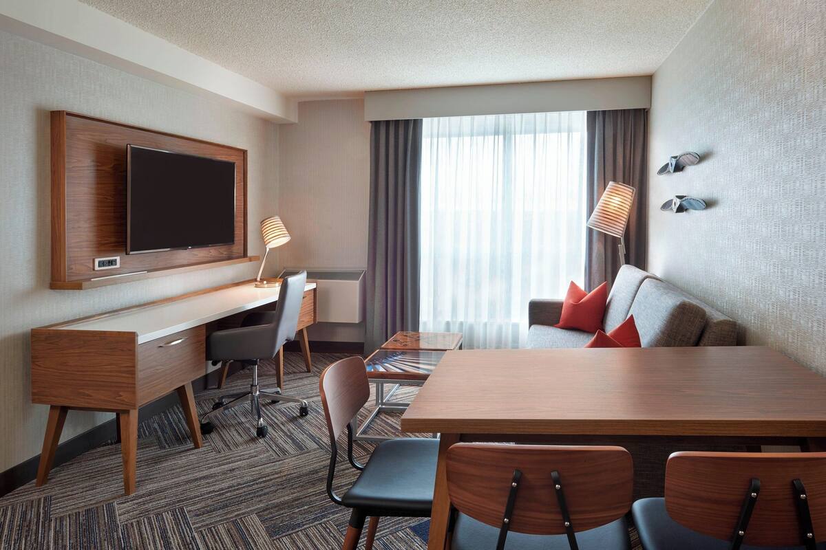 Suite, 1 King Bed with Sofa bed | Living room | 49-inch TV with cable channels