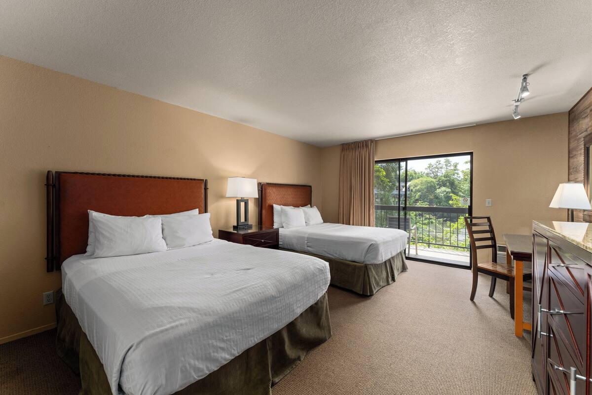 Pillowtop beds, desk, laptop workspace, blackout drapes