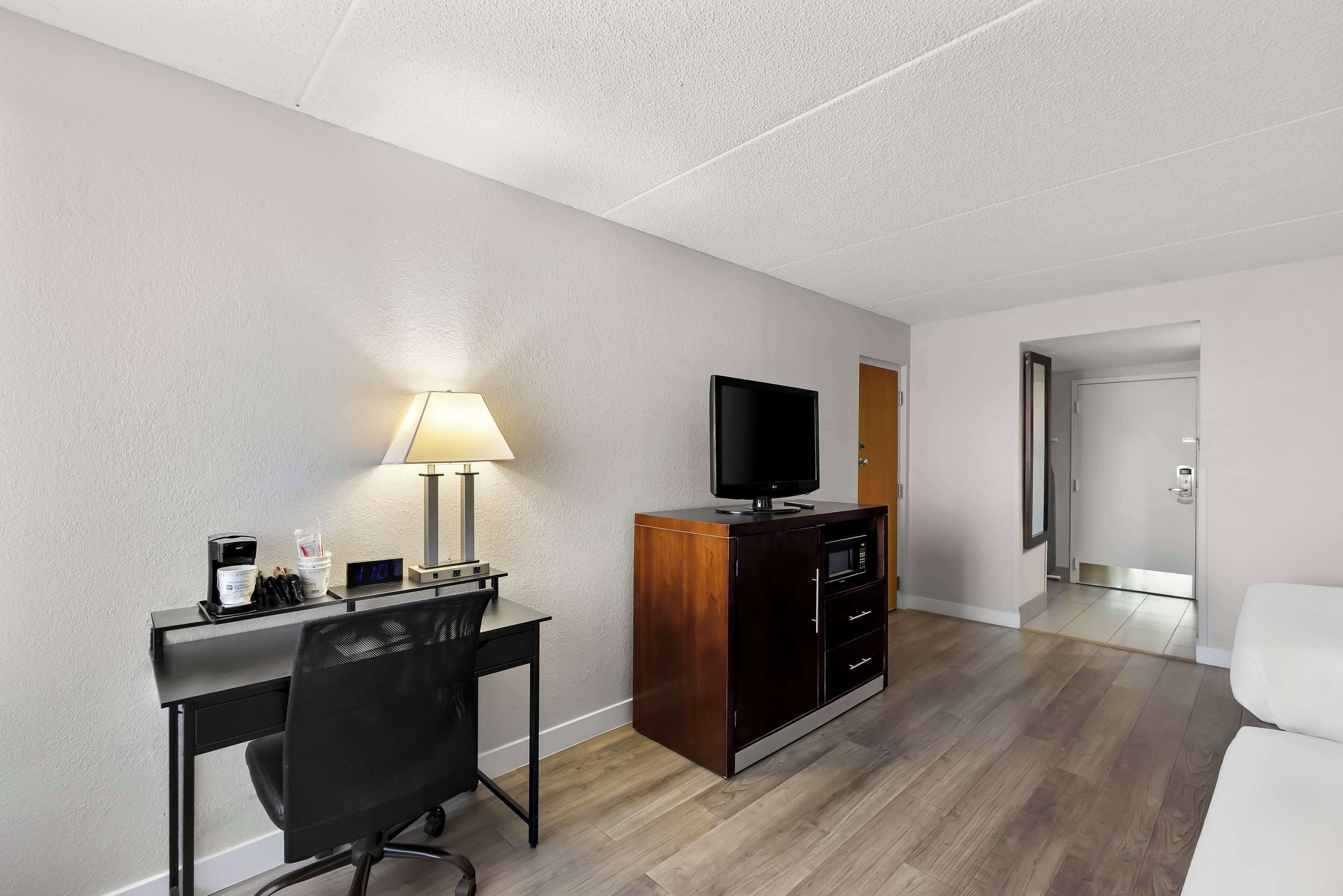 standard room, 2 queen beds, non smoking, refrigerator & microwave (1st floor;pet friendly) | in-room safe, desk, laptop workspace, iron/ironing board