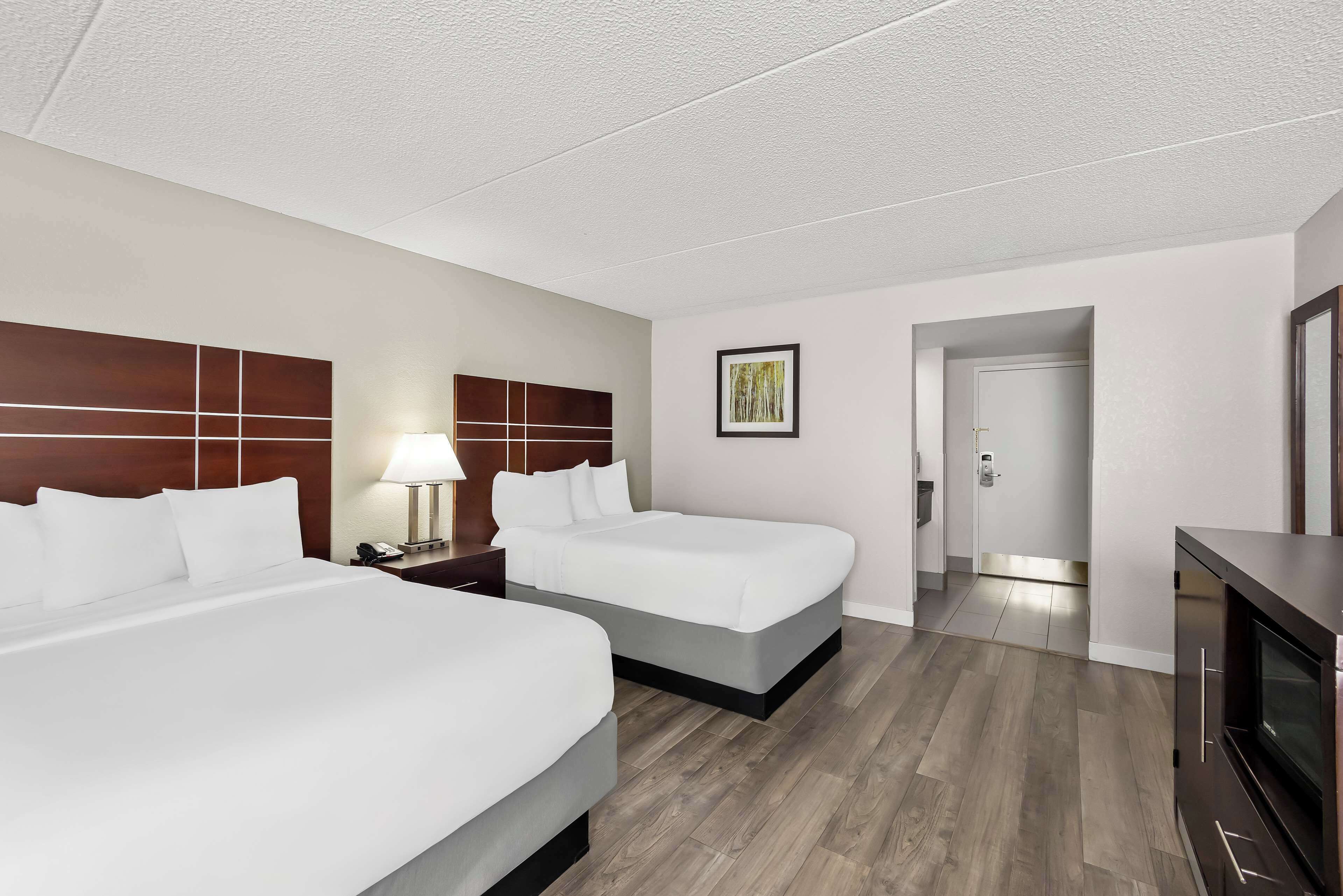 standard room, 2 double beds, non smoking, refrigerator & microwave (1st floor;pet friendly) | in-room safe, desk, laptop workspace, iron/ironing board