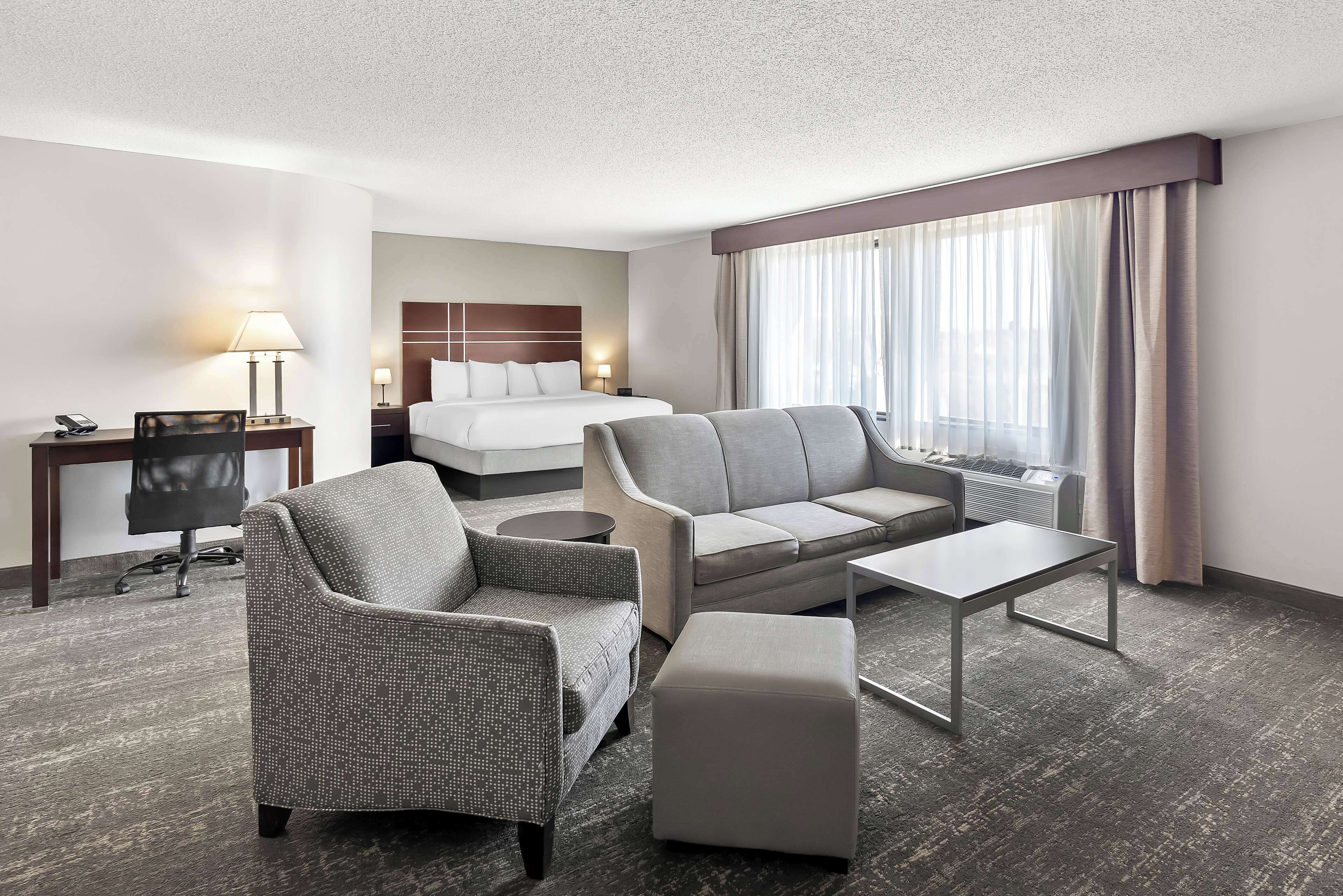 suite, 1 king bed, non smoking, jetted tub (larger room;with sofabed) | in-room safe, desk, laptop workspace, iron/ironing board