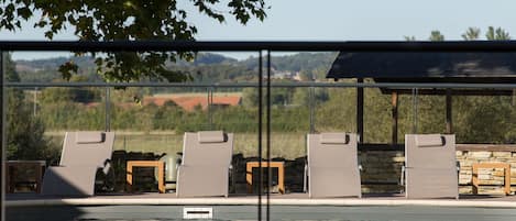 Seasonal outdoor pool, pool loungers