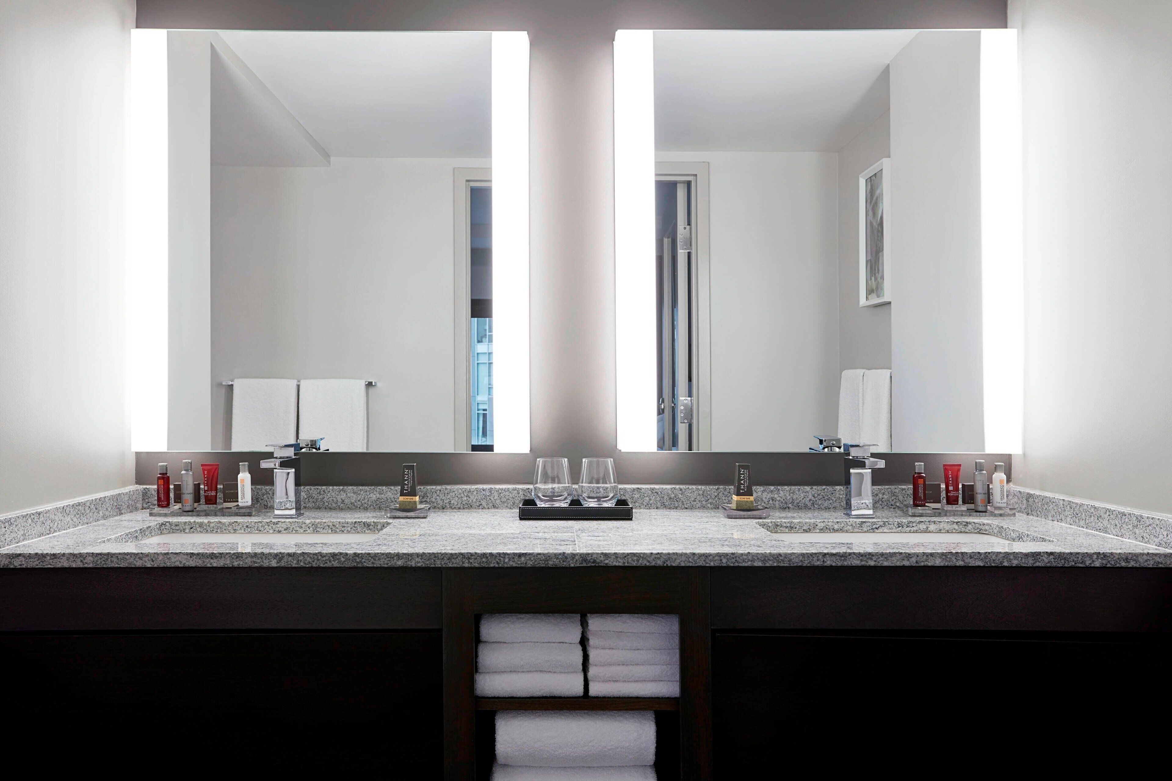 combined shower/bathtub, designer toiletries, hair dryer, towels