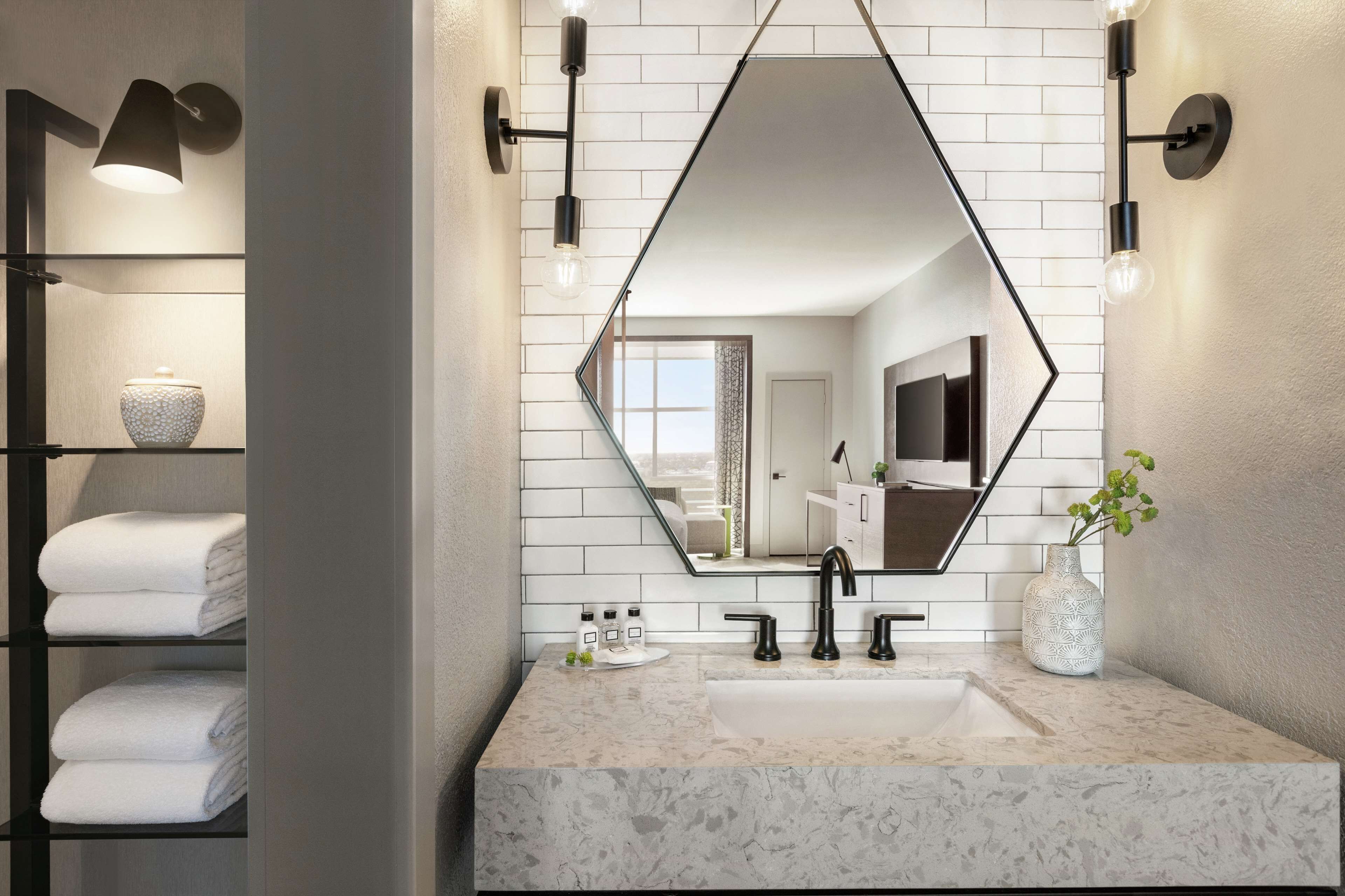 shower, designer toiletries, hair dryer, towels