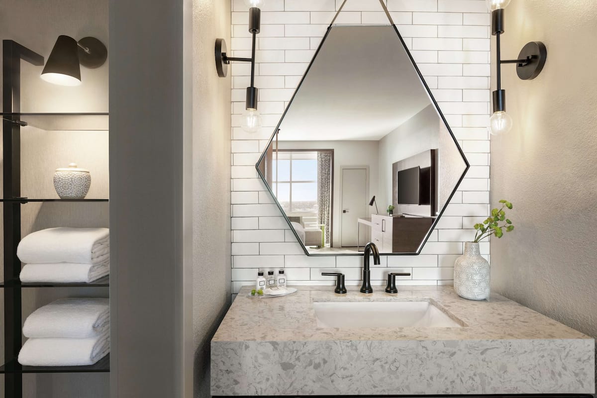 shower, designer toiletries, hair dryer, towels