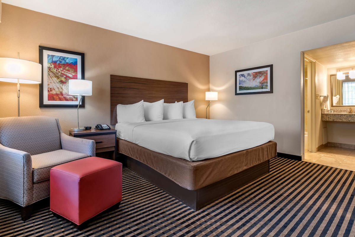 Premium bedding, desk, laptop workspace, iron/ironing board