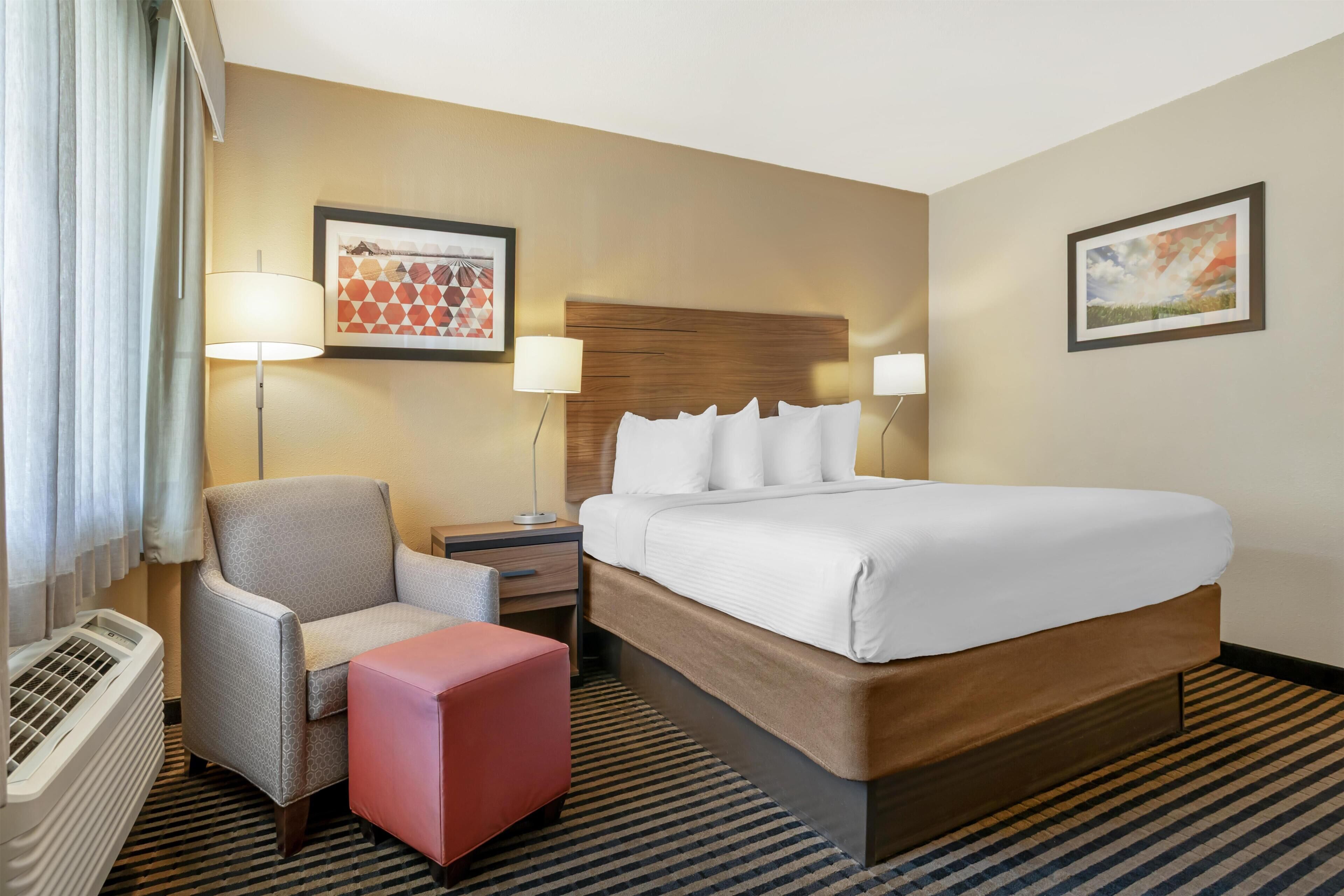 Premium bedding, desk, laptop workspace, iron/ironing board