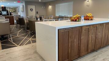 Relax in our spacious lobby, featuring a central island with a cabinet and seating area.